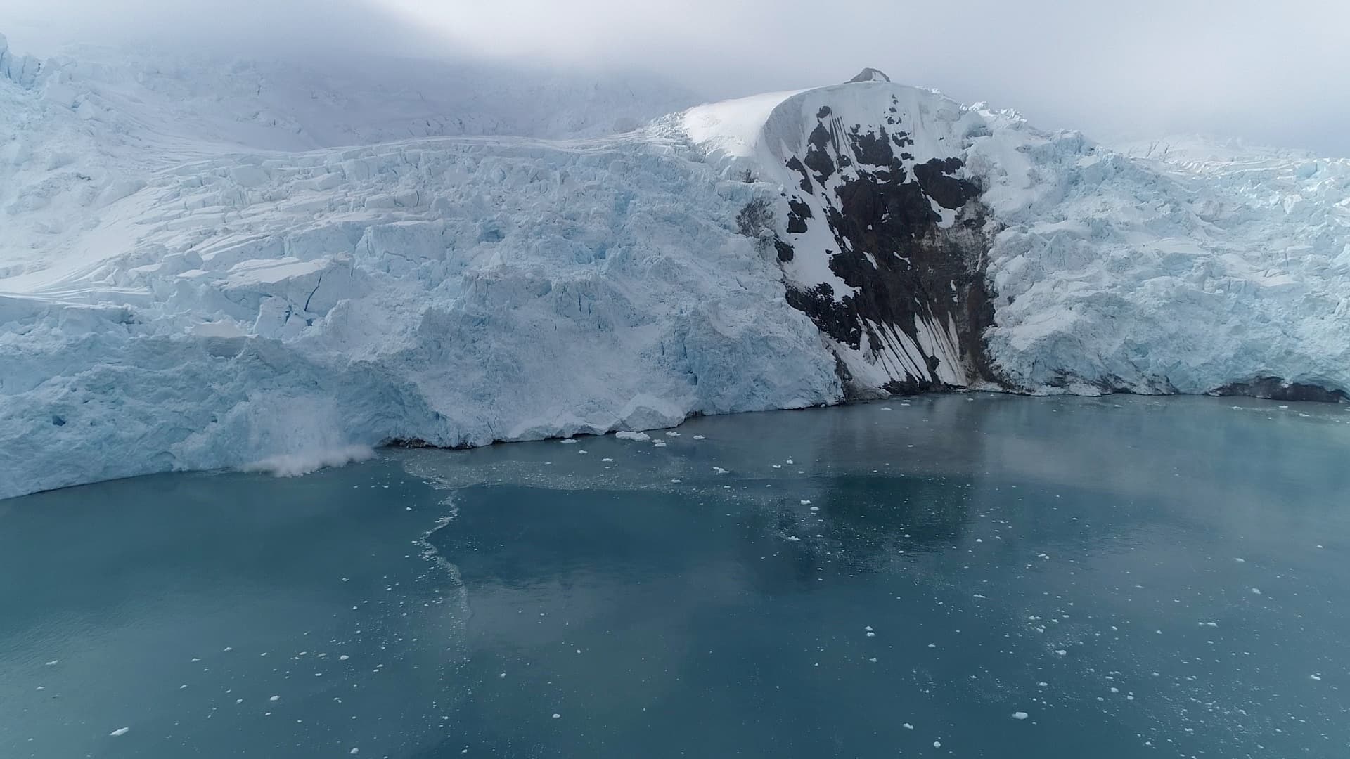 The Znosko glacier front intact, moments before a section collapses into the sea
